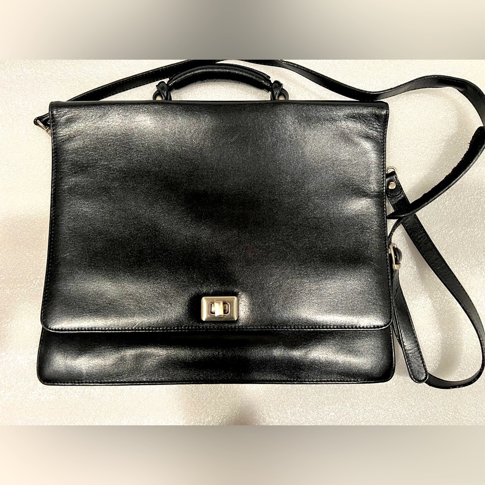 Tumi Black Leather Briefcase with a shoulder strap. Great Used Condition!